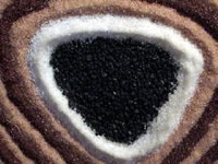 Cuarzo con piedra negra de meteorito (42,407 bytes)